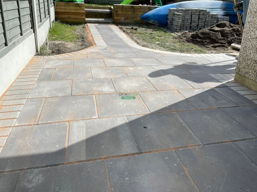 Patio with Charcoal Flags and a Concrete Driveway Extension in Dublin