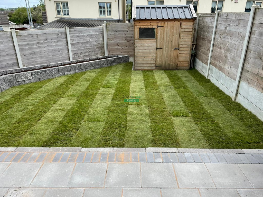 Patio with Classic Flags, Charcoal Borders and Raised Flowerbeds in Rathcoole, Co. Dublin