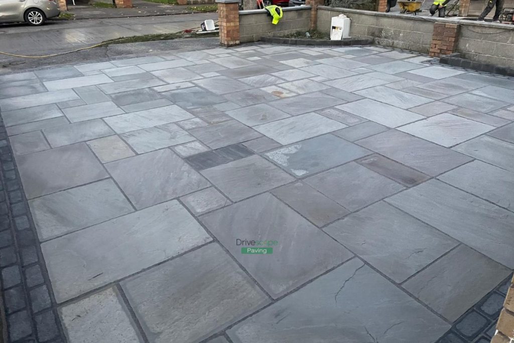 Driveway with Kandla Grey Limestone Slabs and Cobblestone Border in