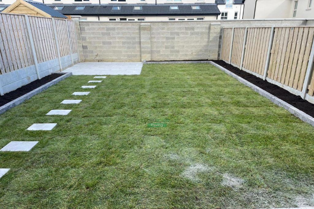 Porcelain Tiled Patio with Raised Flowerbeds and RollonTurf in