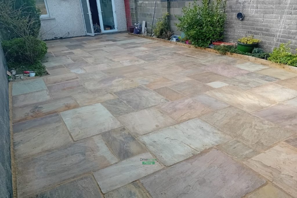 Patio with Newgrange Granite Slabs and Charcoal Border, New Steps and